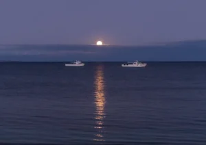 Moonlight and two fishing boats