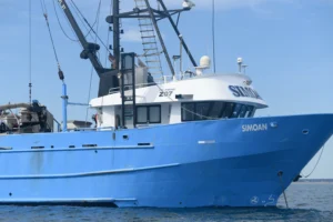 A blue fishing boat up close