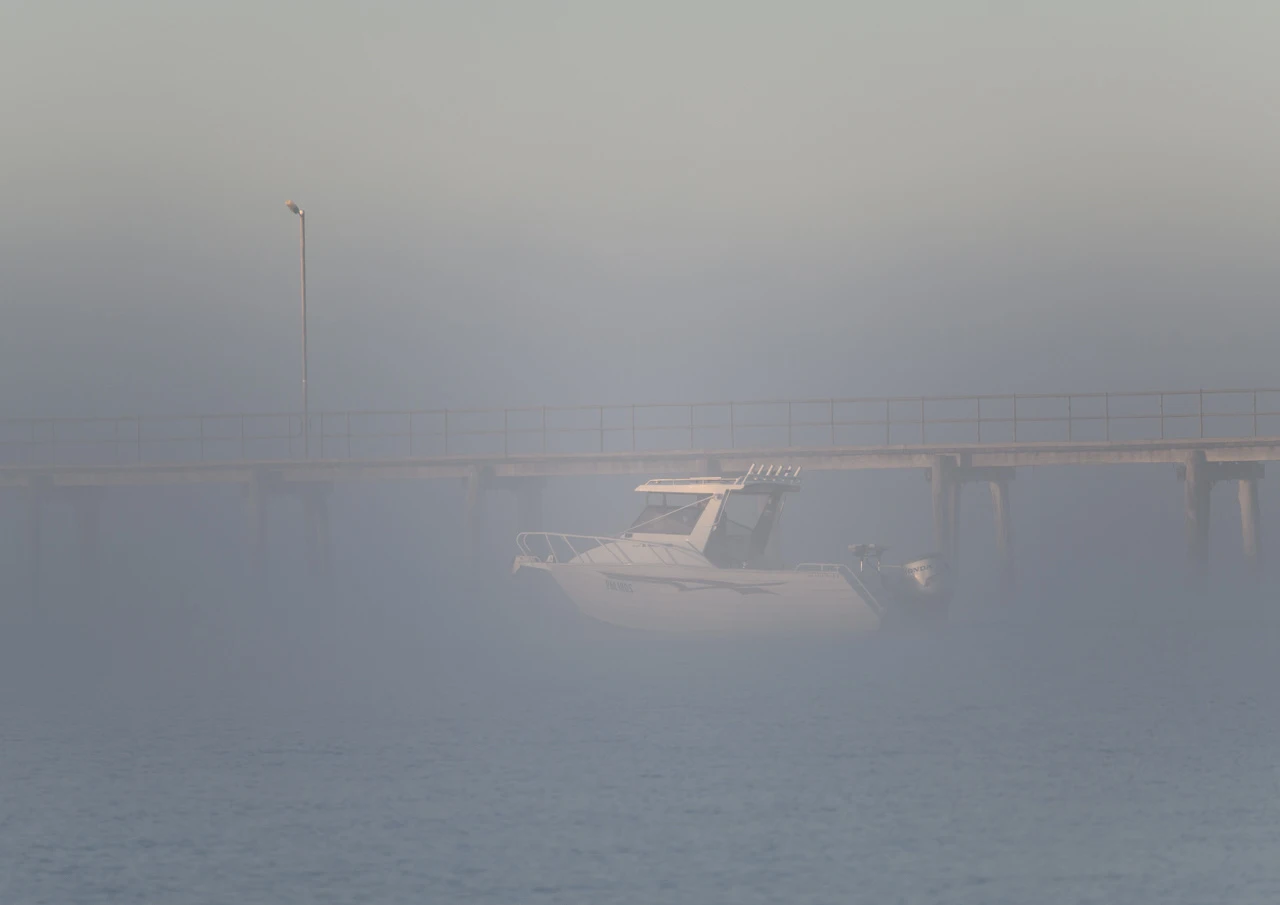 Fishing boat in the fog