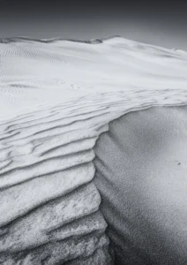 The curves of the sand in a desert made by the wind