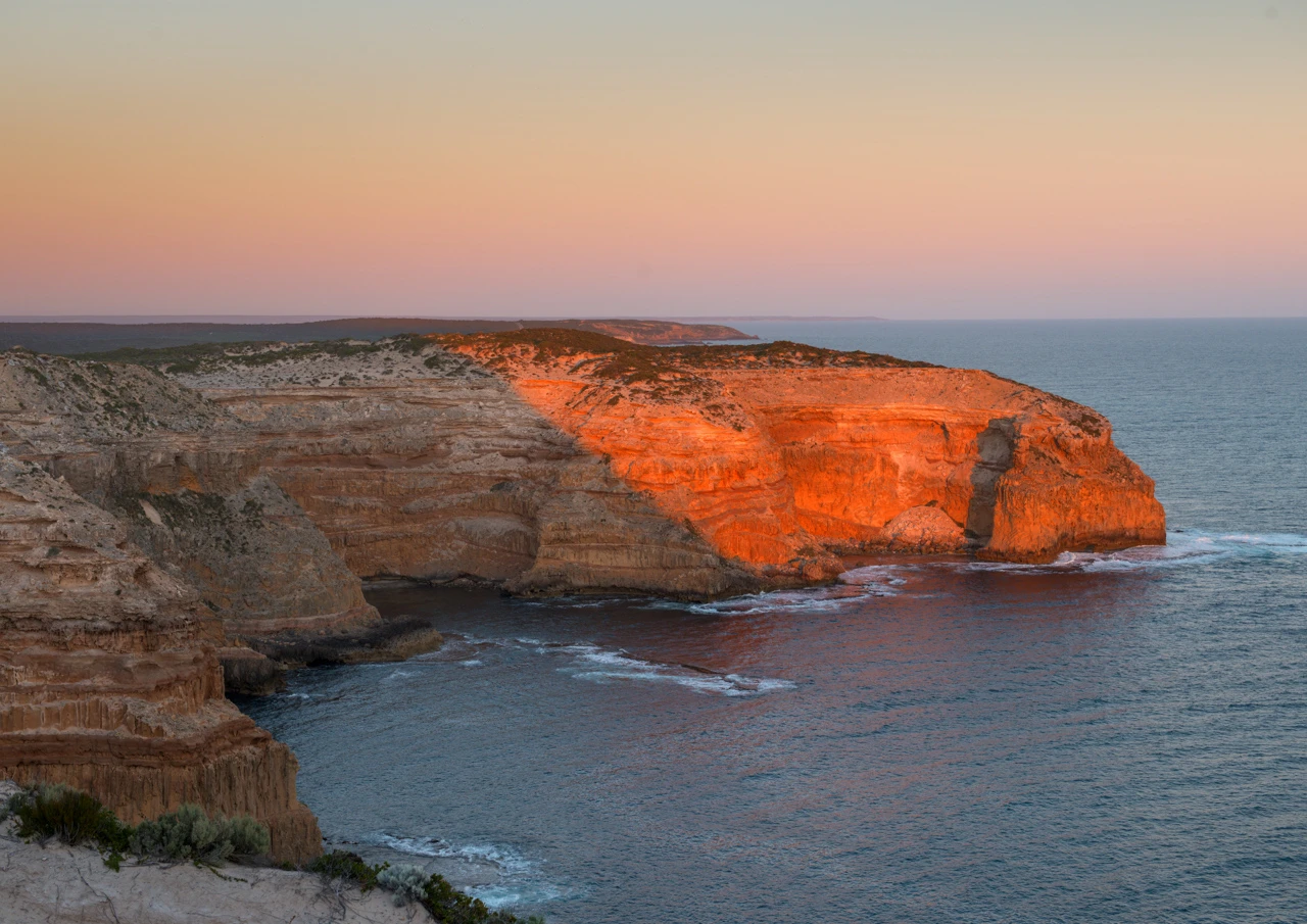 Cliffs looking down from Cape Spencer Massive cliffs in the setting sun. Cape Spencer