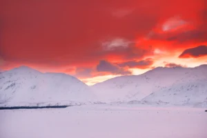 Very red sky over the mountains in Hakatere Heron Road New Zealand