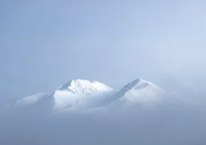 Two peaks of Mount Potts showing through the fog