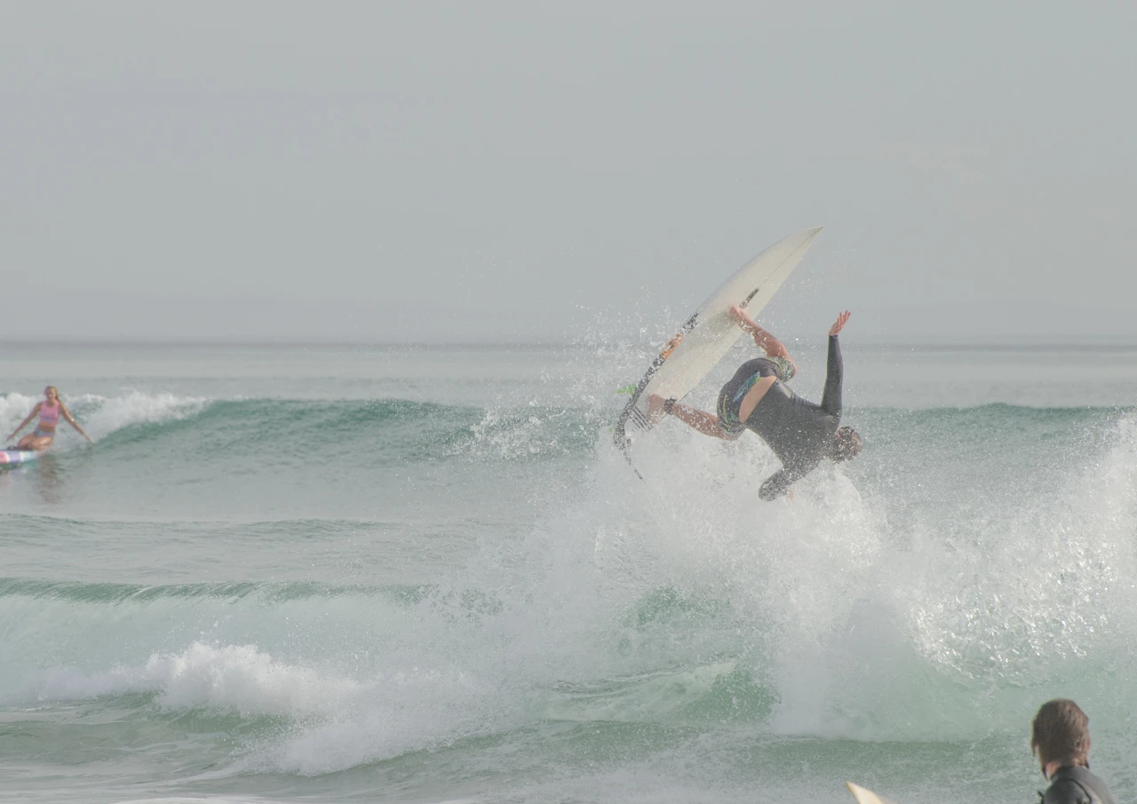 Surfer leaping in seaspray Surfer jumping