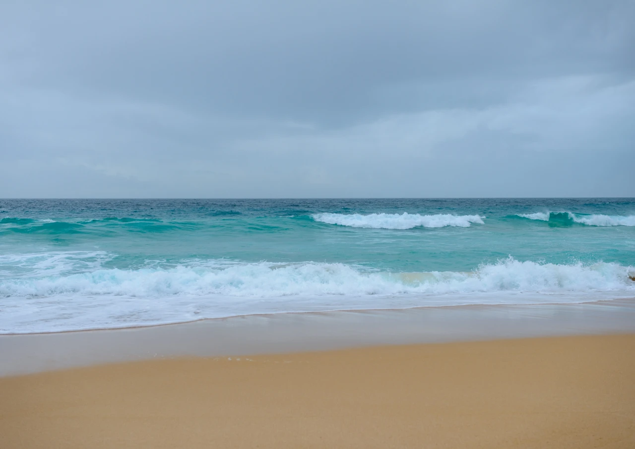 The fading of the day at the beach Turquoise beach and waves rolling in