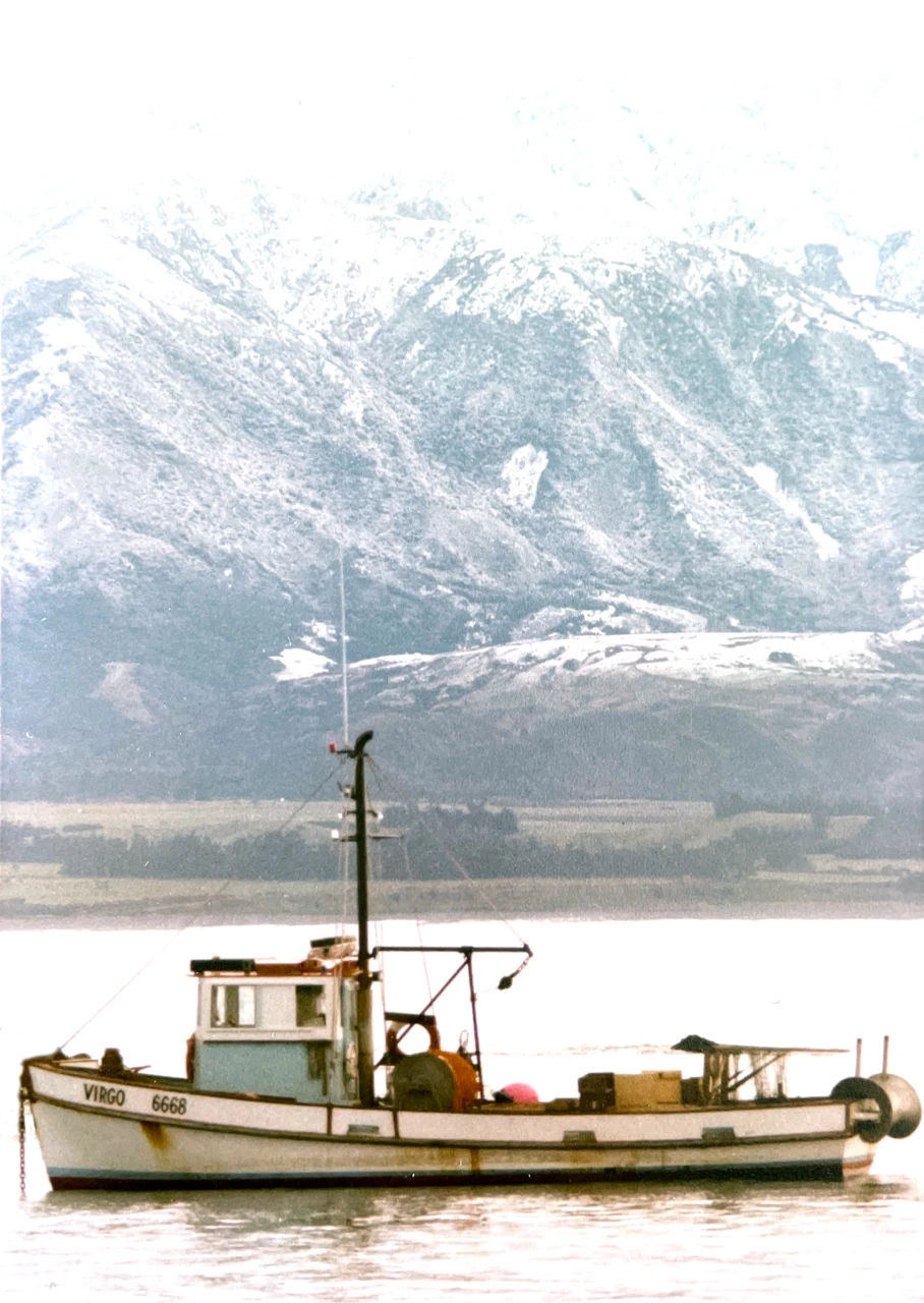Fishing boat and Kaikoura moutains Fishing boat and Kaikoura mountains