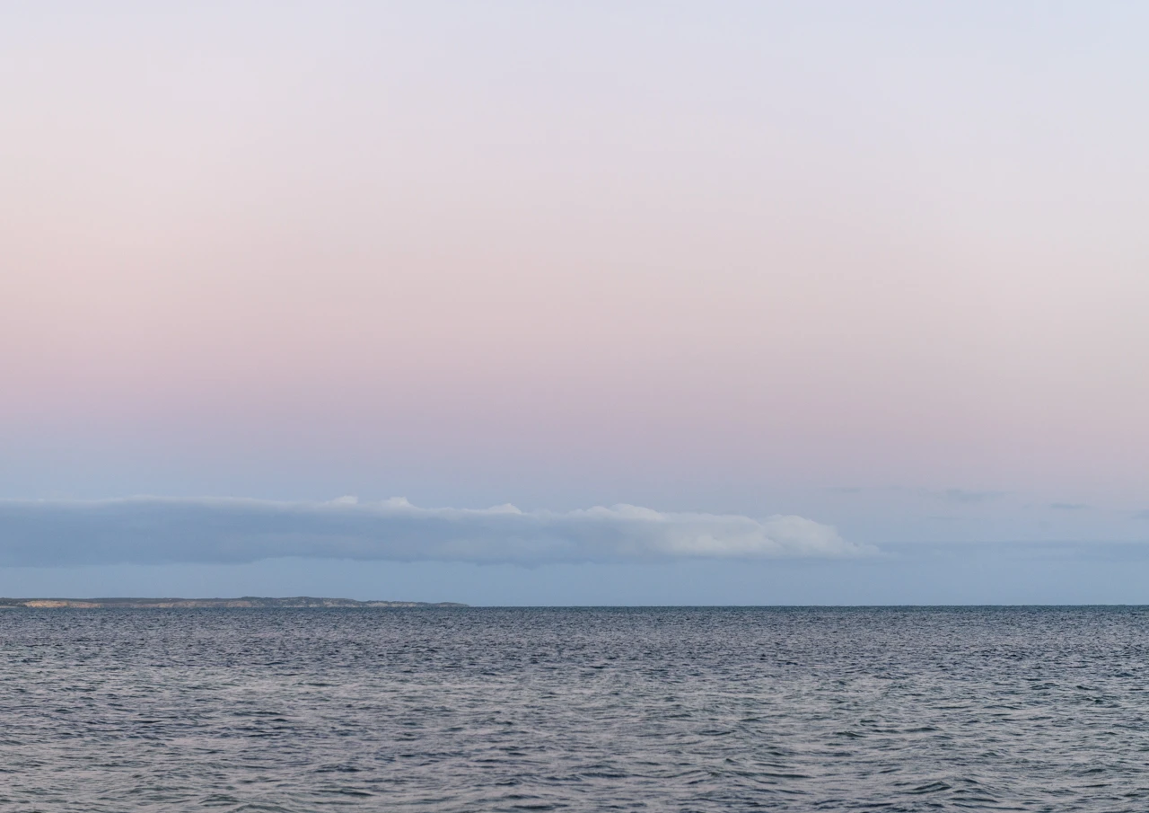 Beautiful evening, beach and distant land Pink evening Marion Bay coastline