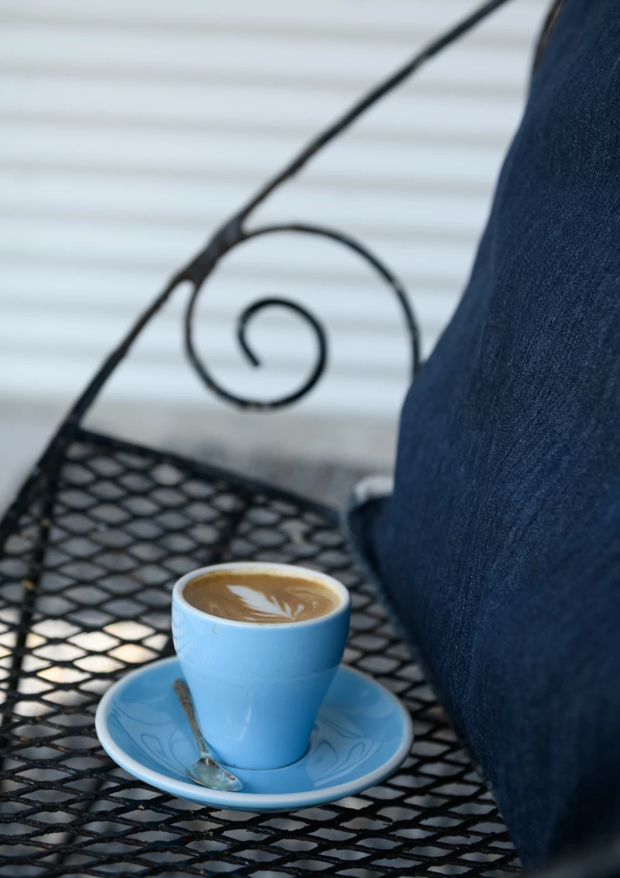Coffee outdoors on garden seat Coffee outdoors