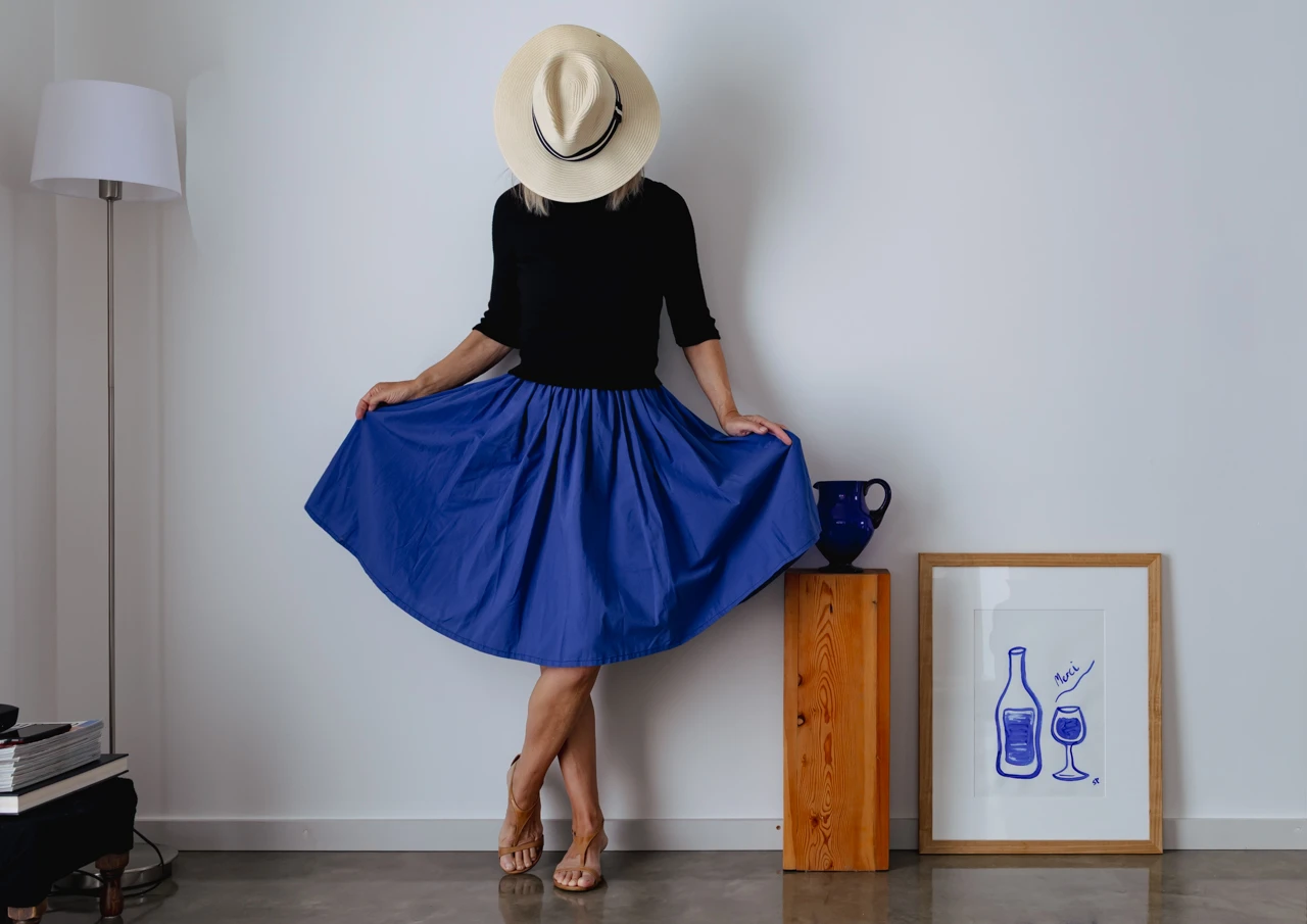 Wendy Philip in blue skirt and sun hat