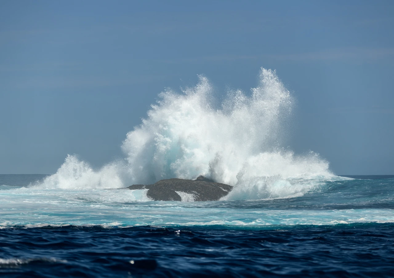 Eames reef splashing over the rocks below Eames reef and splashing high