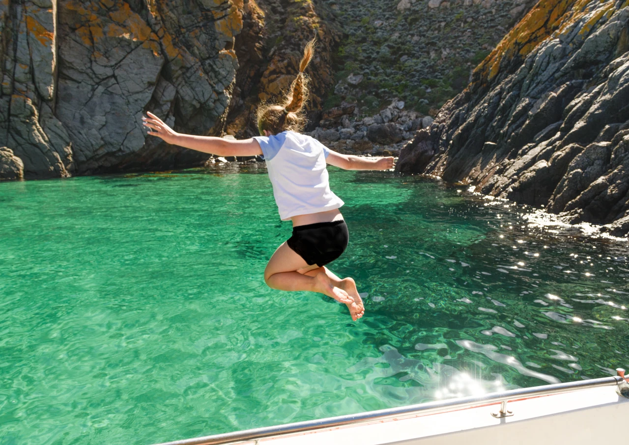 Jumping into the sea at Salmon Inlet Althorpe Island