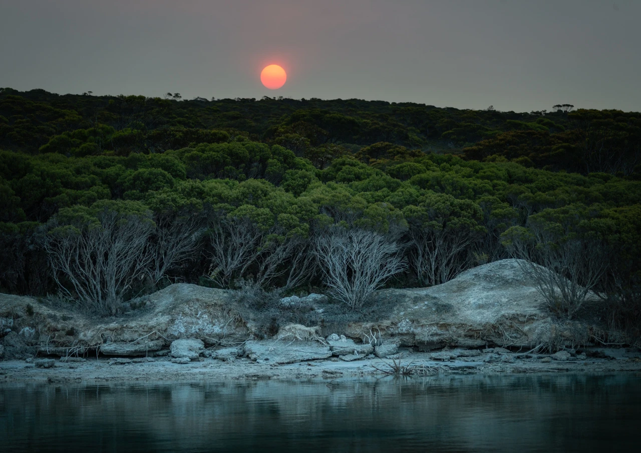 Red sun from the Melbourne fires over Innes Lake Yorke Peninsula