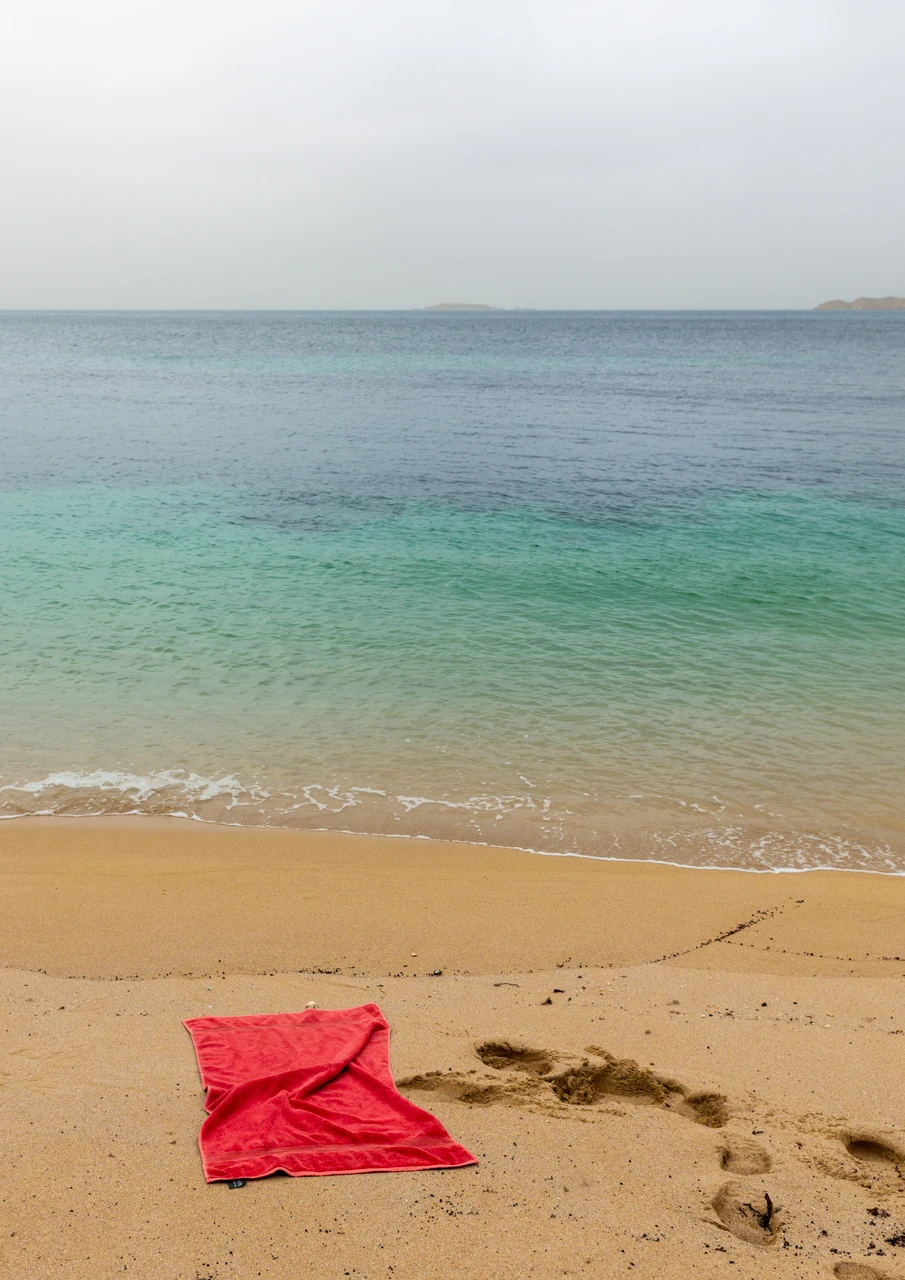 Red towel on the beach