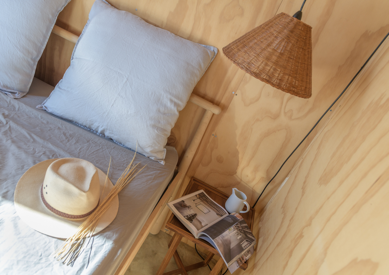 Bedroom corner cane lampshade and wooden walls