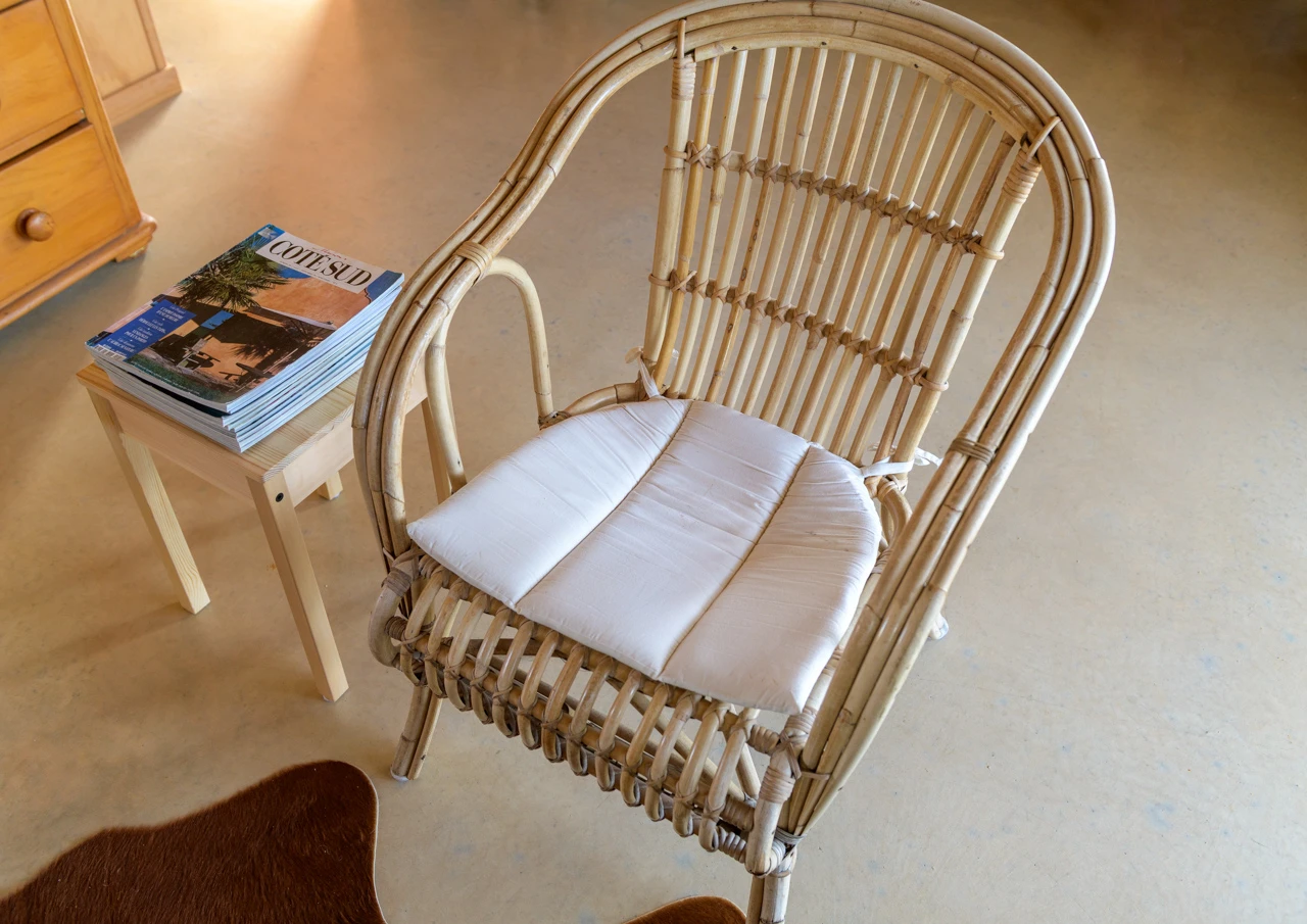 Cane chair sitting and reading