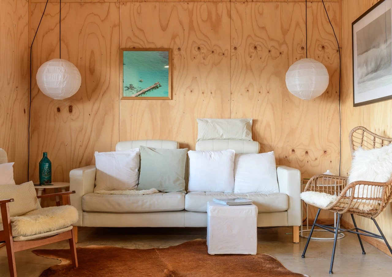 Lounge with couch and wooden walls
