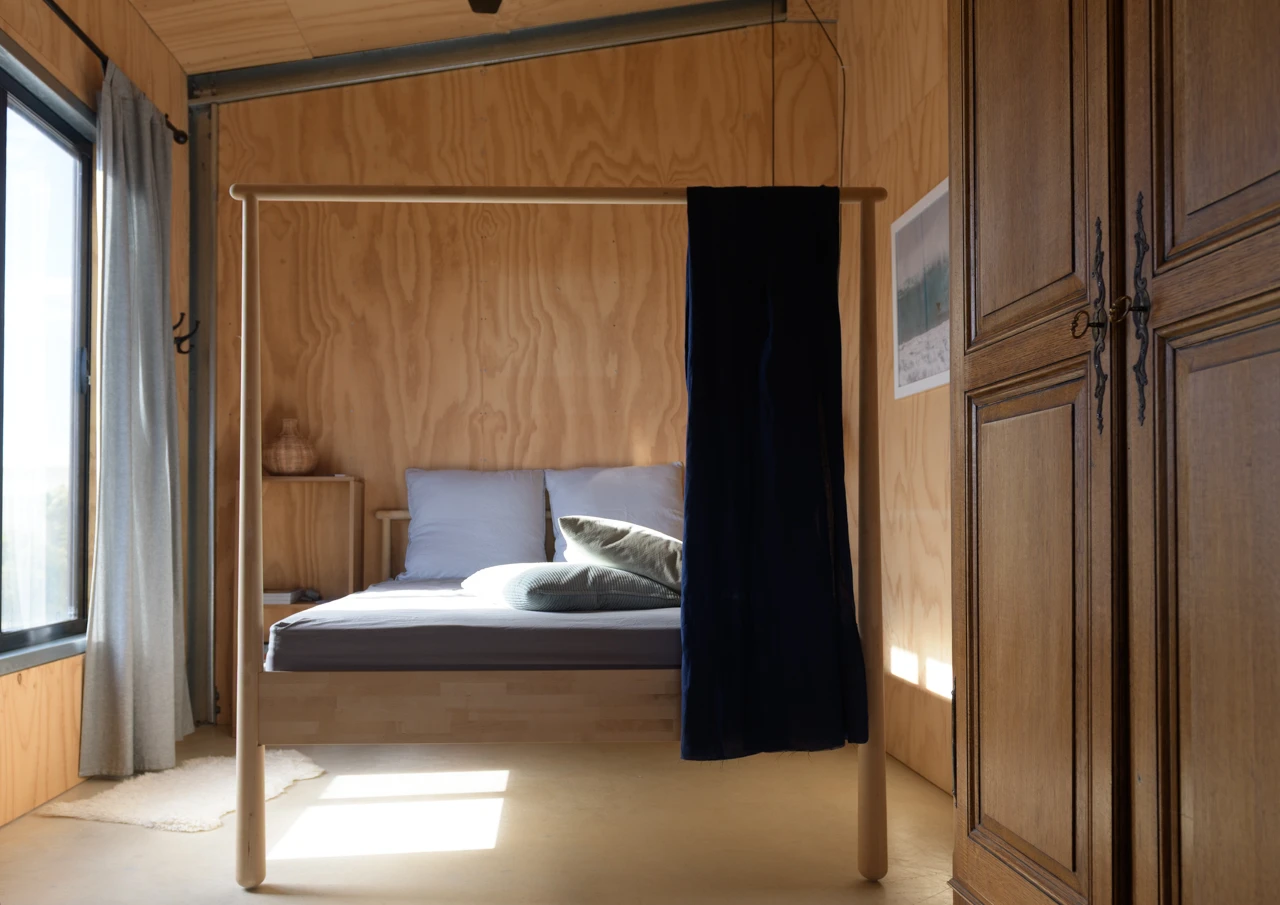 Queen bed and wooden walls interiors