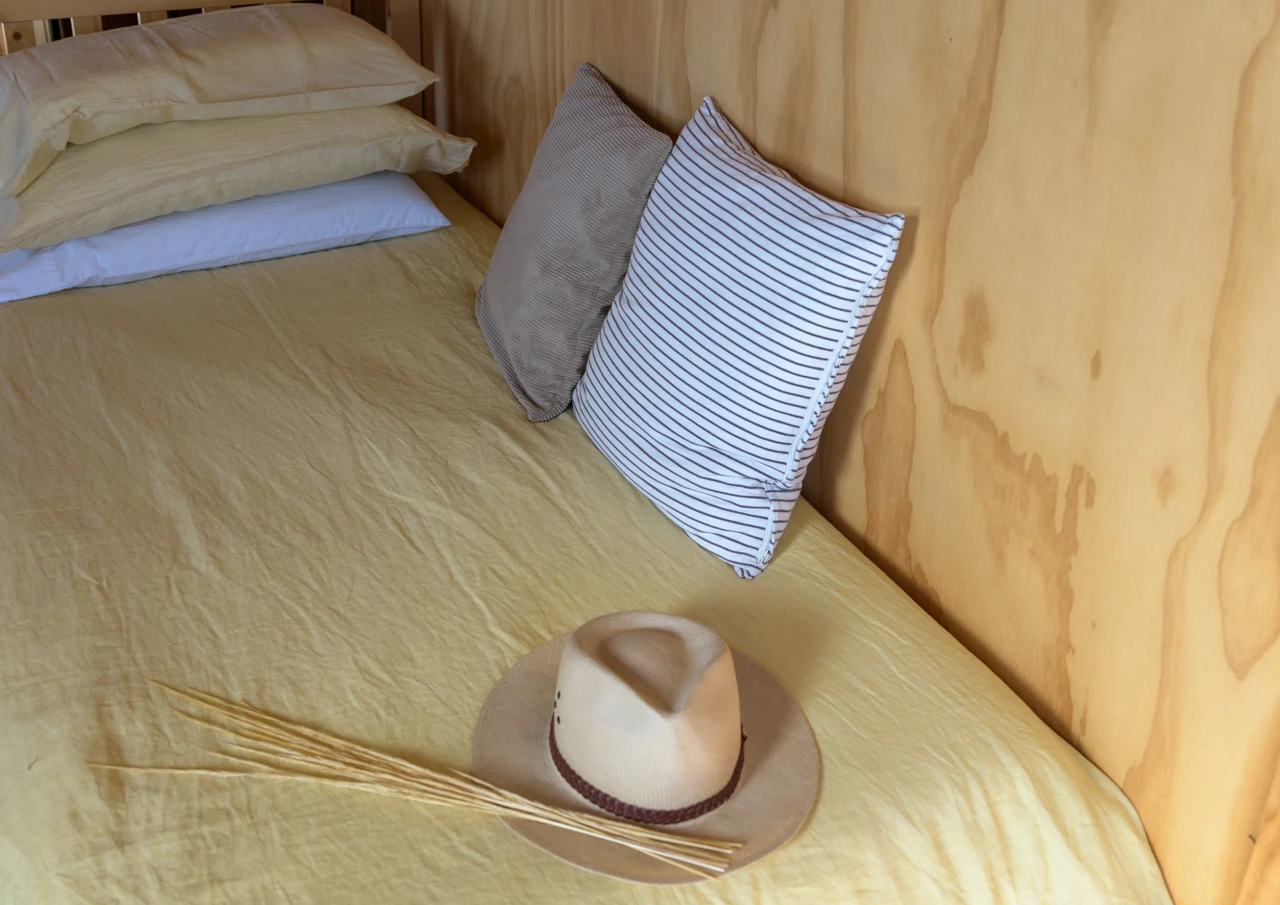 Single bed and yellow duvet cover, interiors