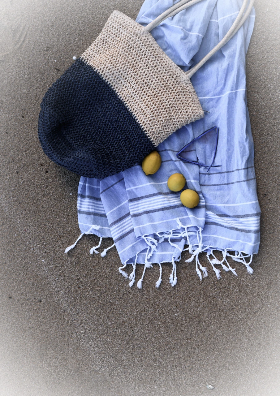 Blue saroong and lemons on the beach