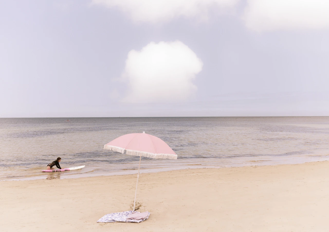 Under my pink umbrella Pink umbrella on the beach vintage style
