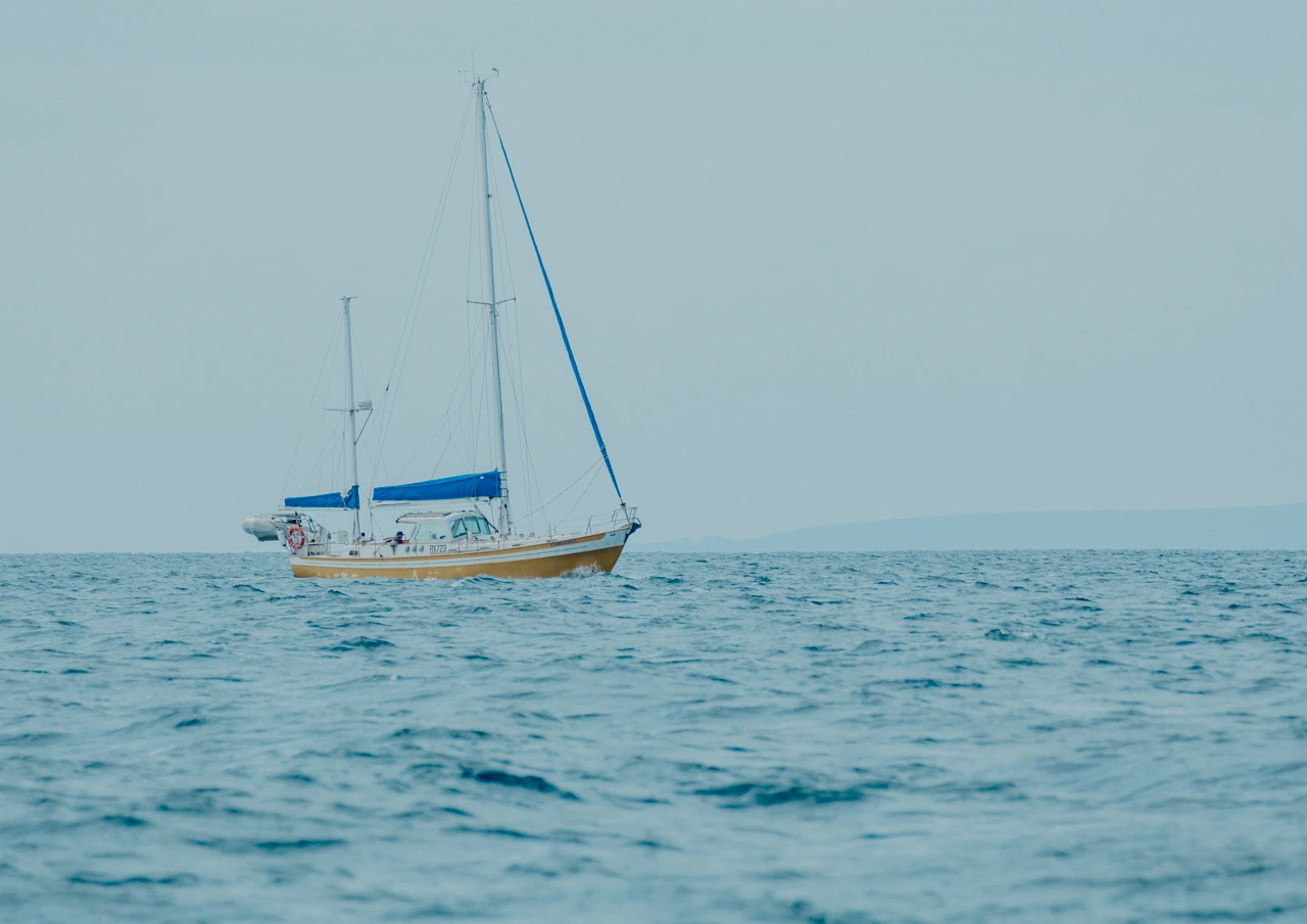Yellow yacht with vintage effects applied