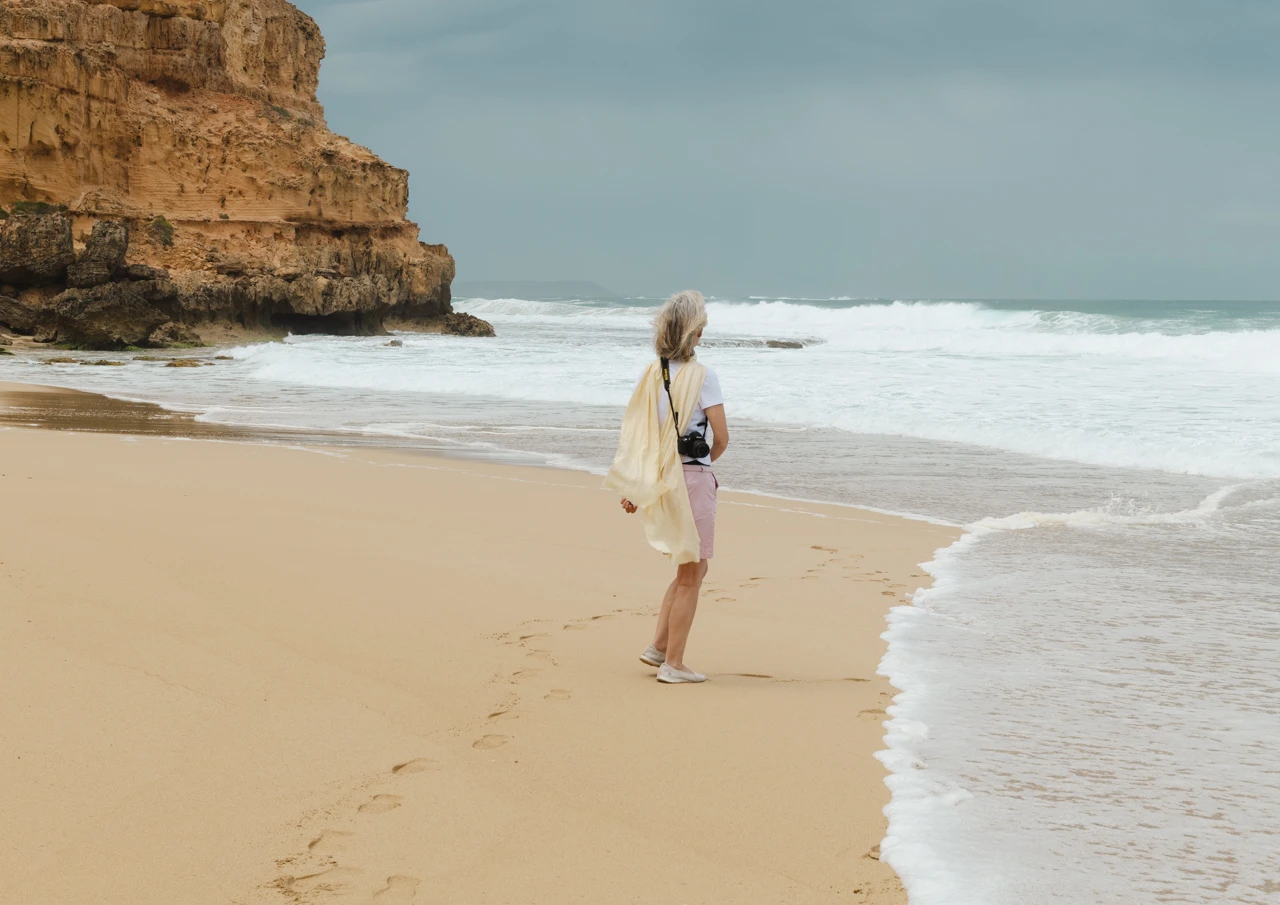 Girl at beach with camera Girl at the beach with a camera