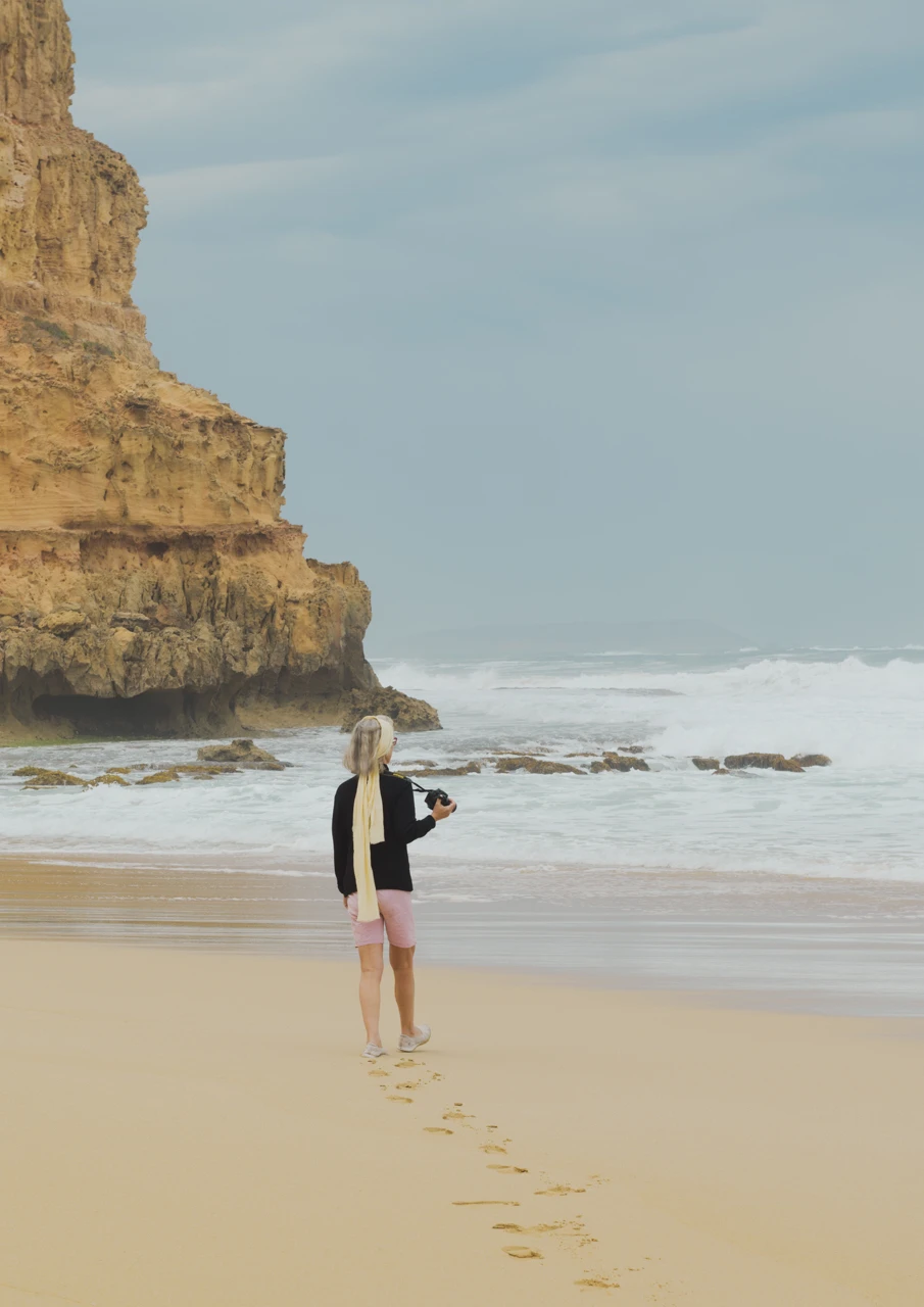 Girl taking photographs Girl taking photos at the beach