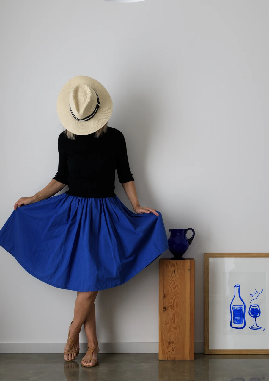 Wendy philip in blue dress with blue jug and picture Wendy Philip in blue skirt