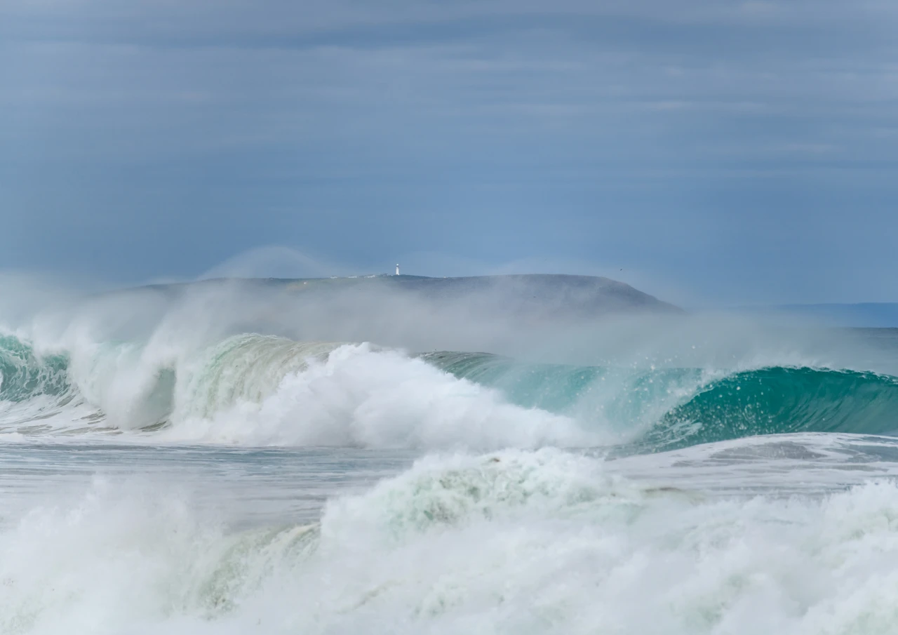A big wave with Althorpe Island in the background Waves and Althorpe island in the background. South Australia