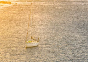 A Tuscan sunset, a yacht moored in the bay.