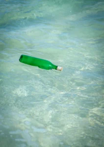 A floating green bottle