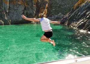Girl jumping in at Slamon Inlet