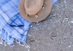 Sunhat, sunglasses and saroong at the beach