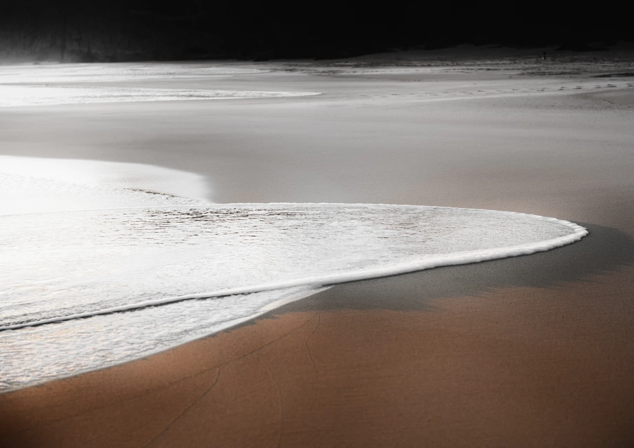 Orange sand and dark colours at Etel beach South Australia