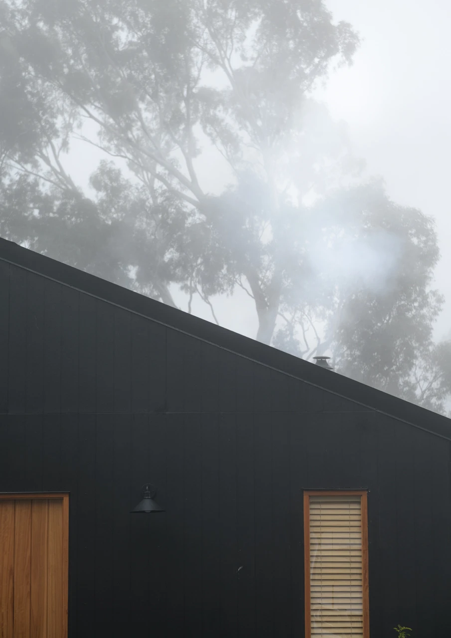Black house on a foggy day