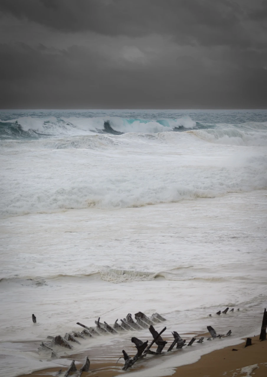 Foam washes on to the shore.