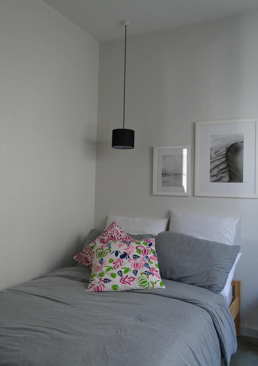 Grey bed in spare room